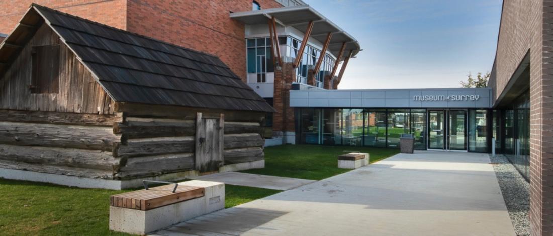 Entrance to the museum, near a log cabin