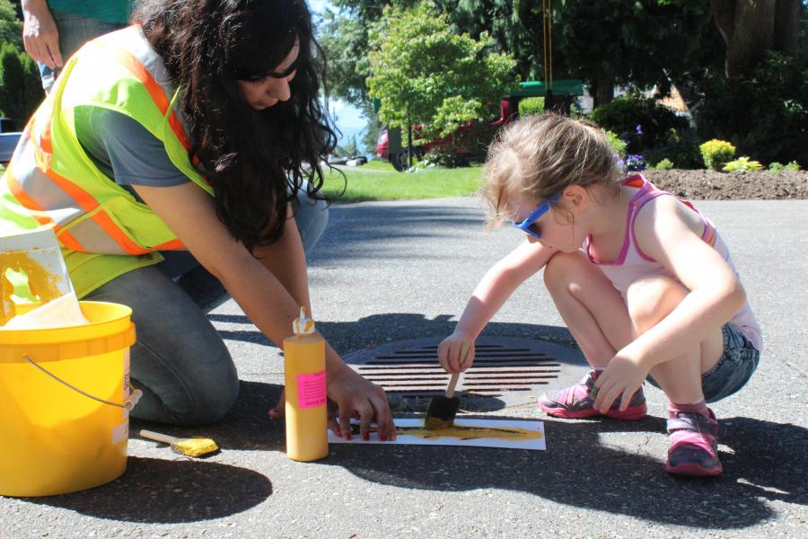 Volunteers doing the storm drain marking challenge