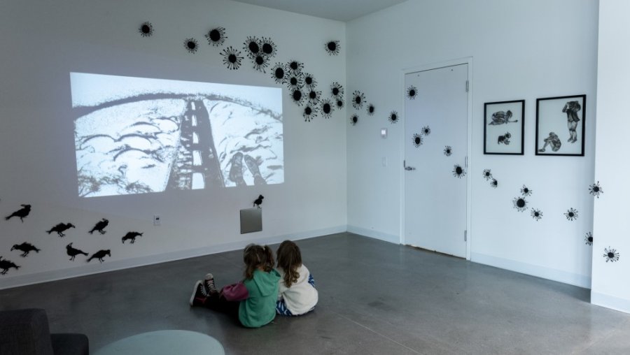 children watching shadow puppets